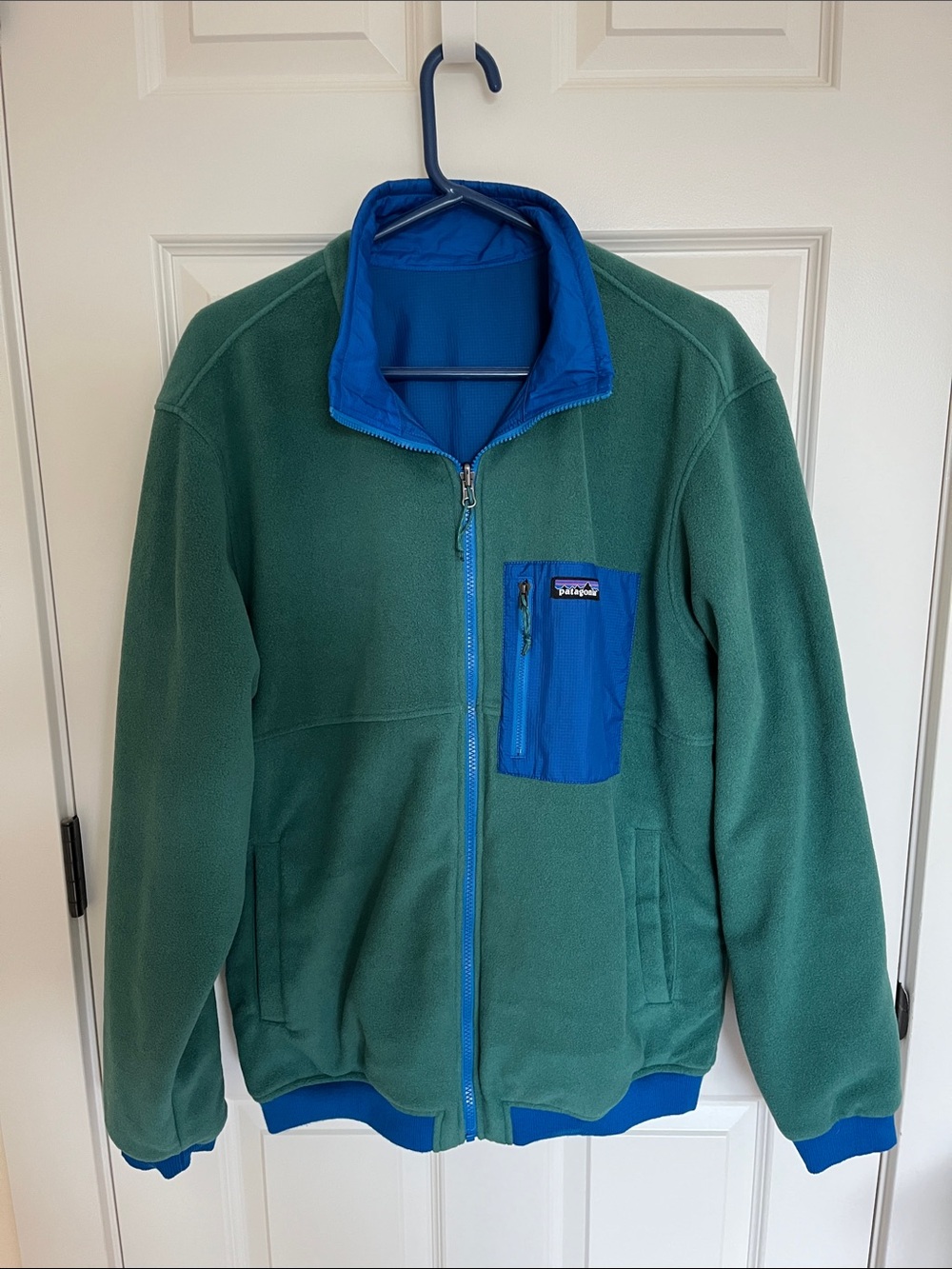 Patagonia Green Fleece/Royal Blue Nylon reversible jacket.